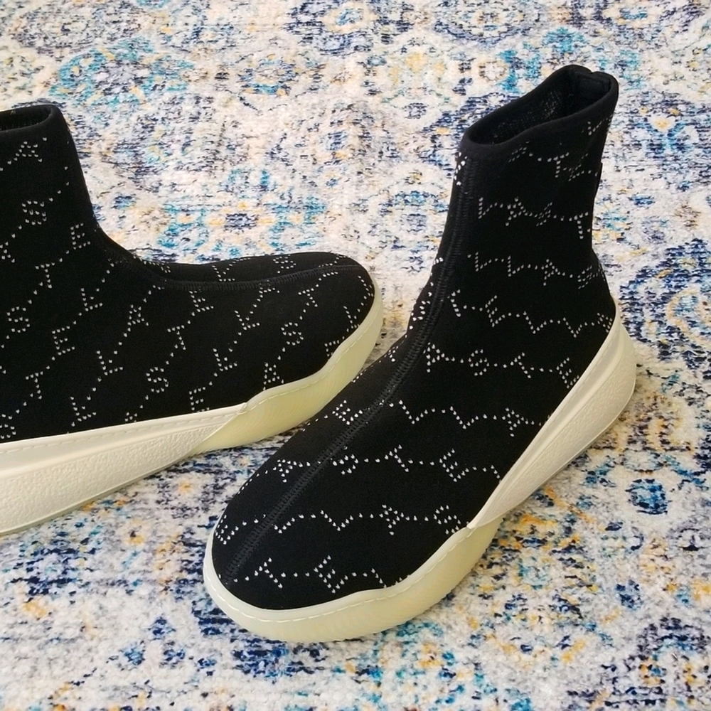 $735 Stella McCartney Loop Monogram Sock Sneakers